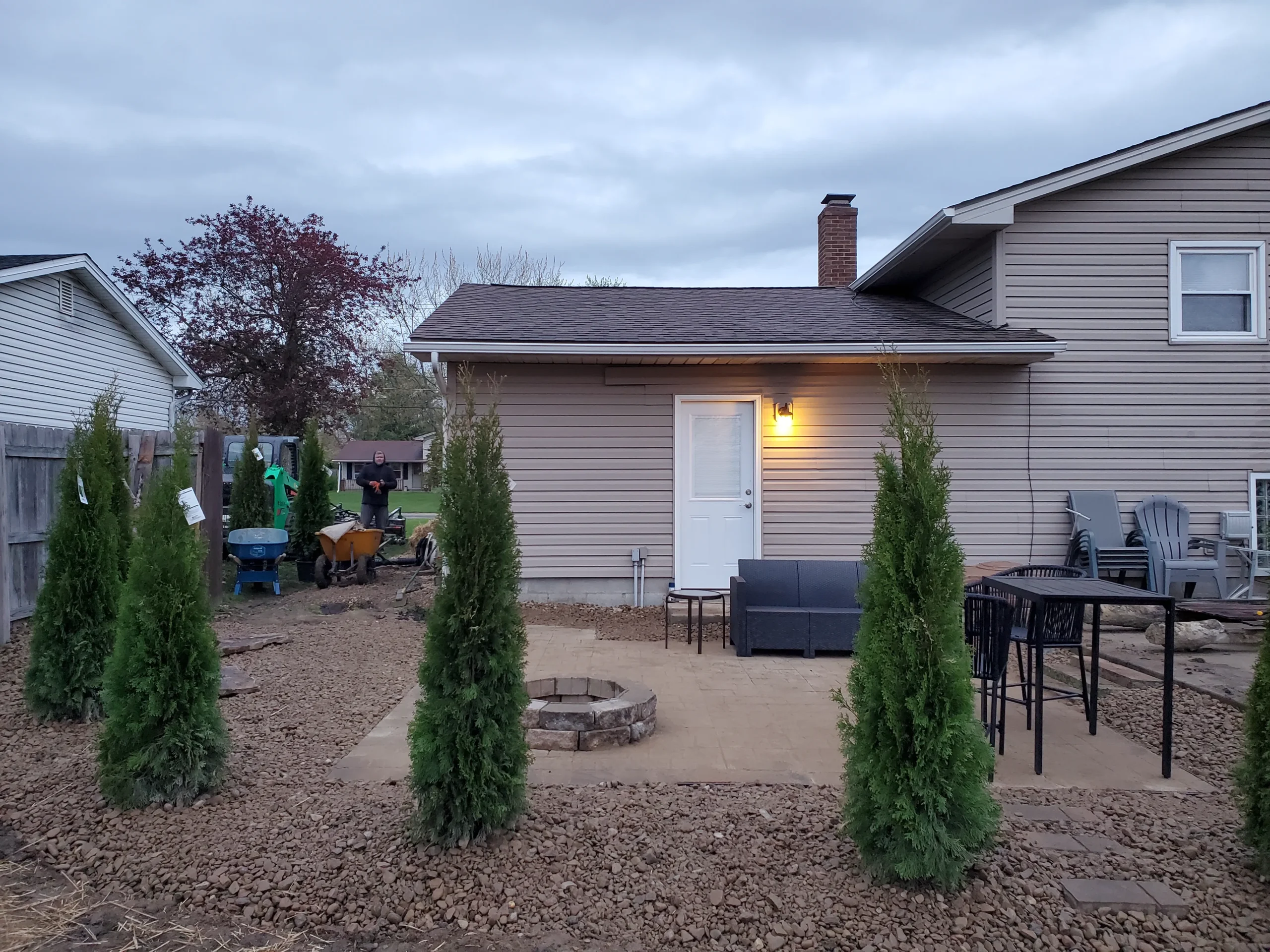Custom outdoor patio installation with pavers and stone design