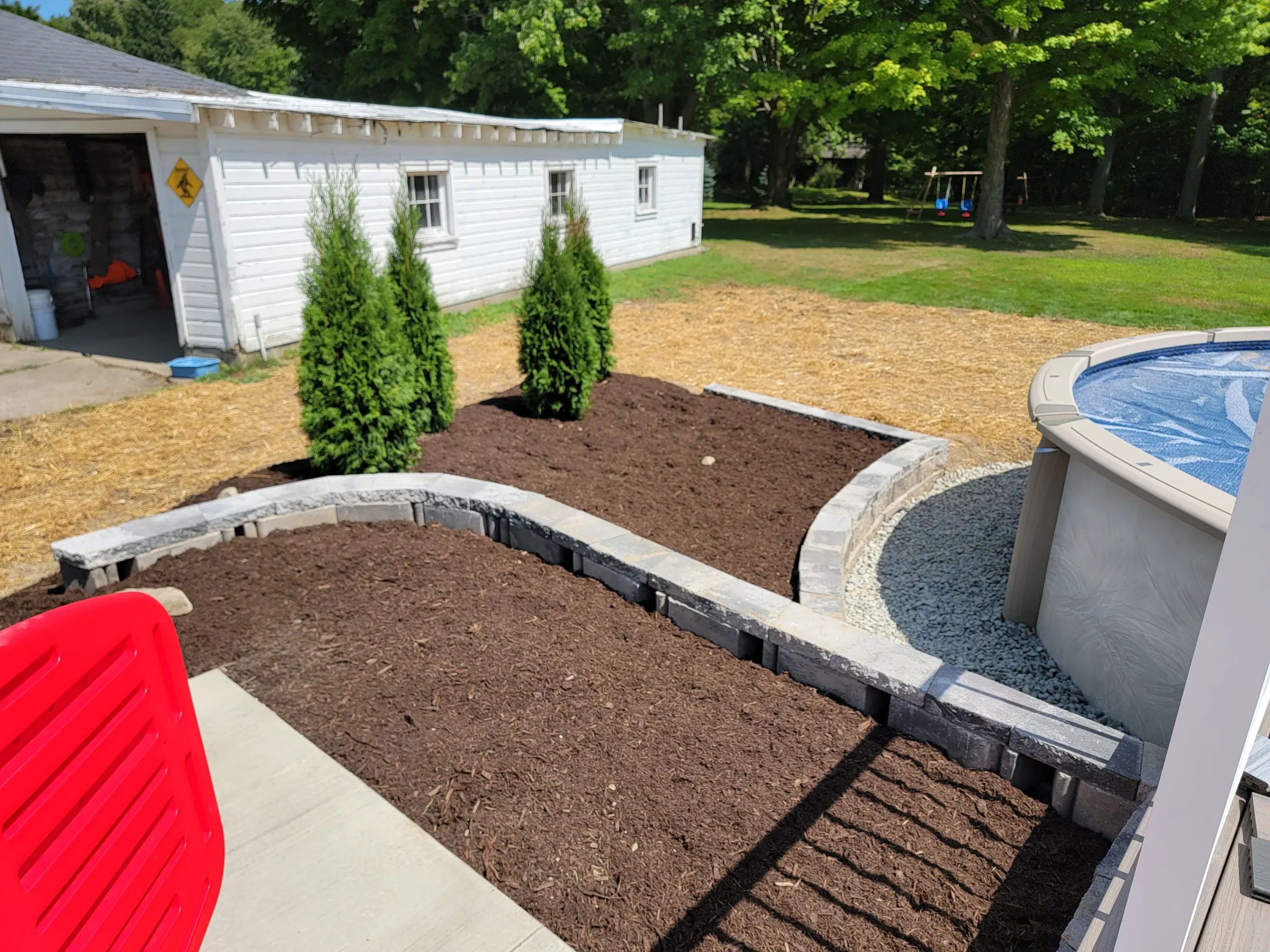 Professional landscaping with lawn, plants, and outdoor design features