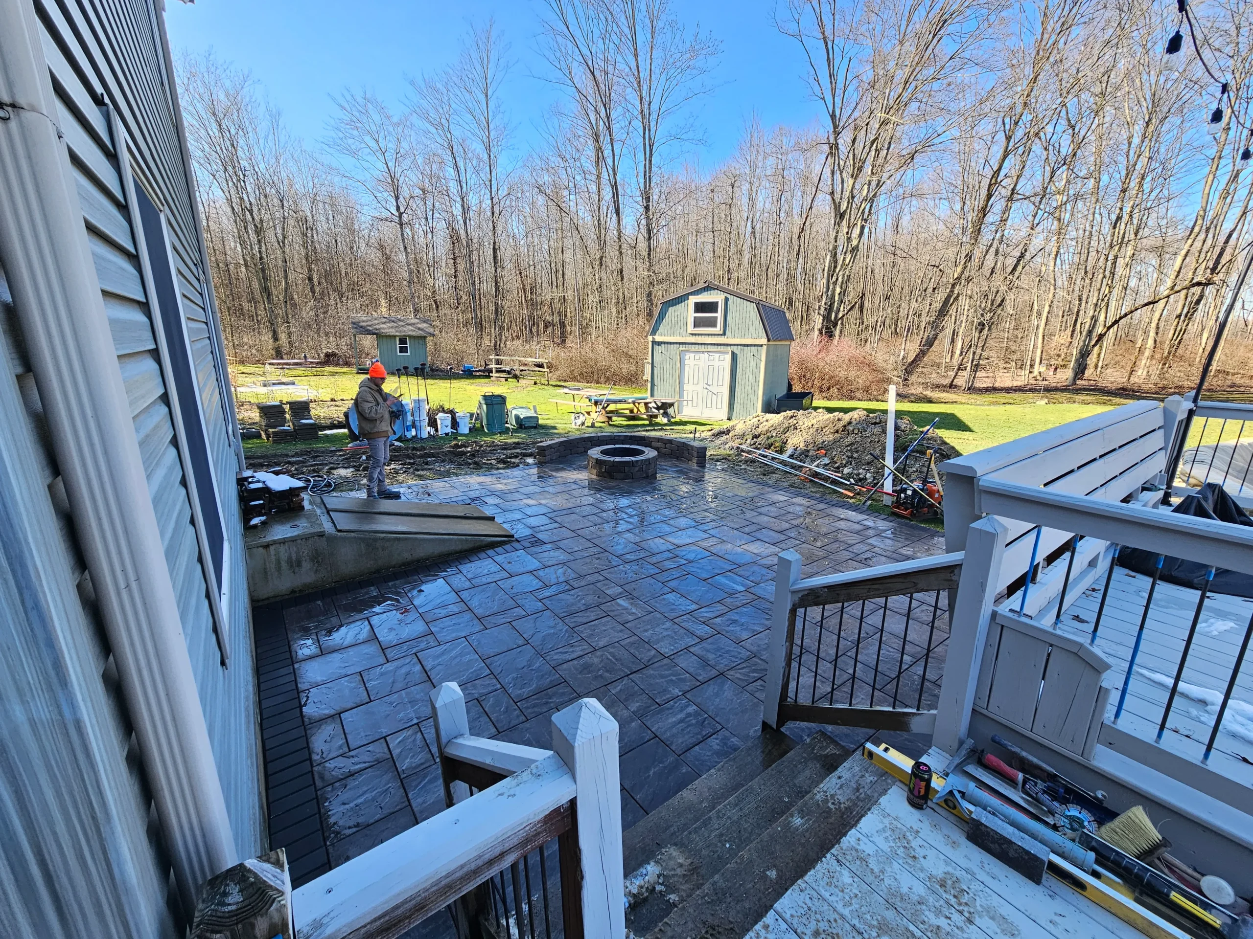 Professional landscaping with lawn, plants, and outdoor design features