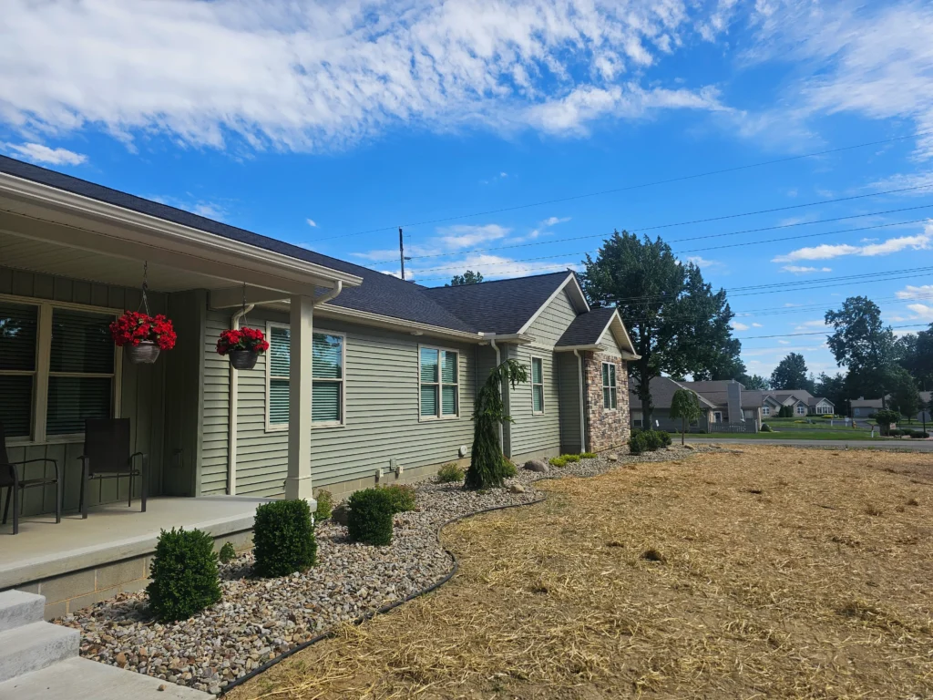 Professional landscaping with lawn, plants, and outdoor design features