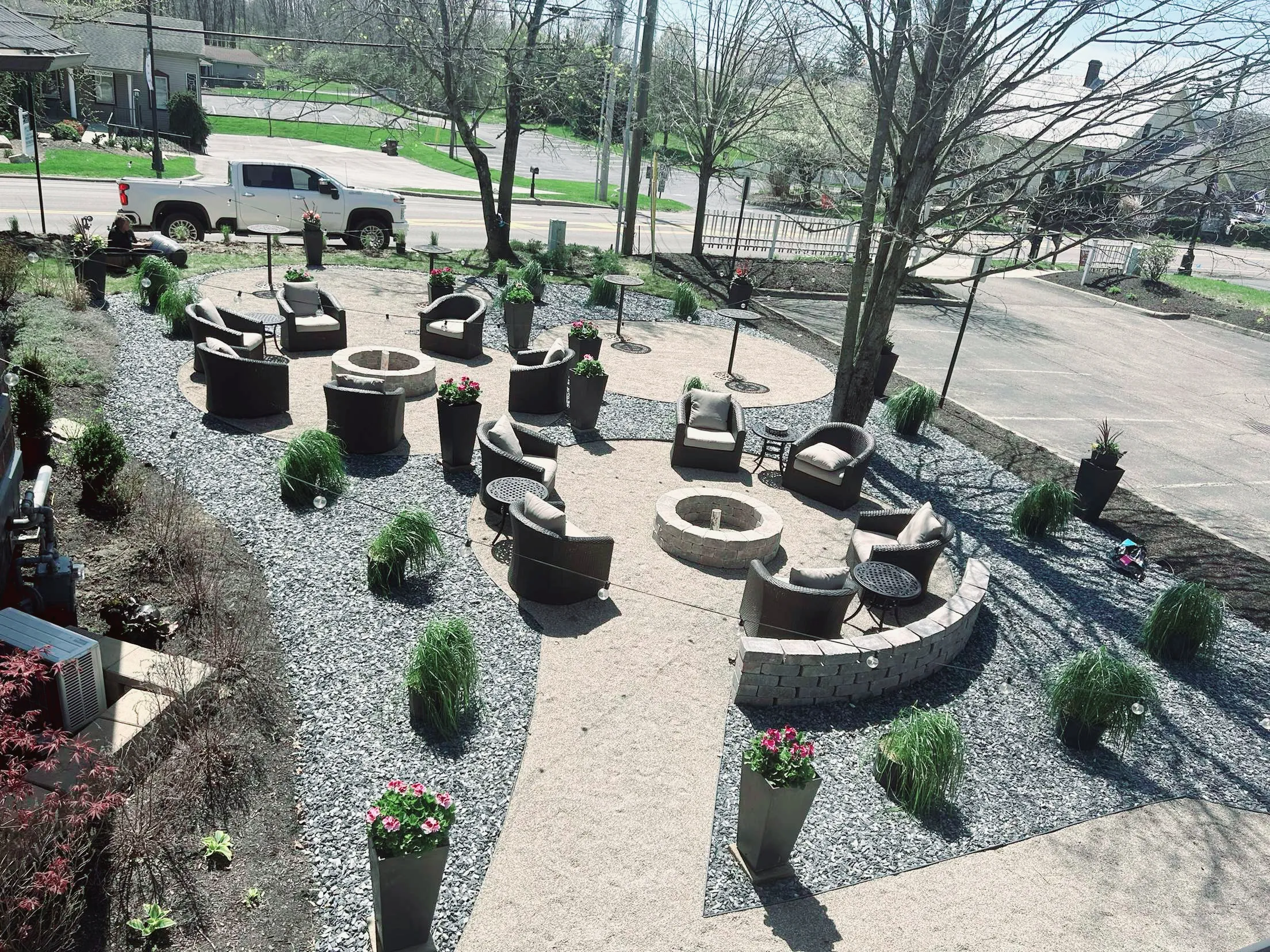 Custom outdoor patio installation with pavers and stone design