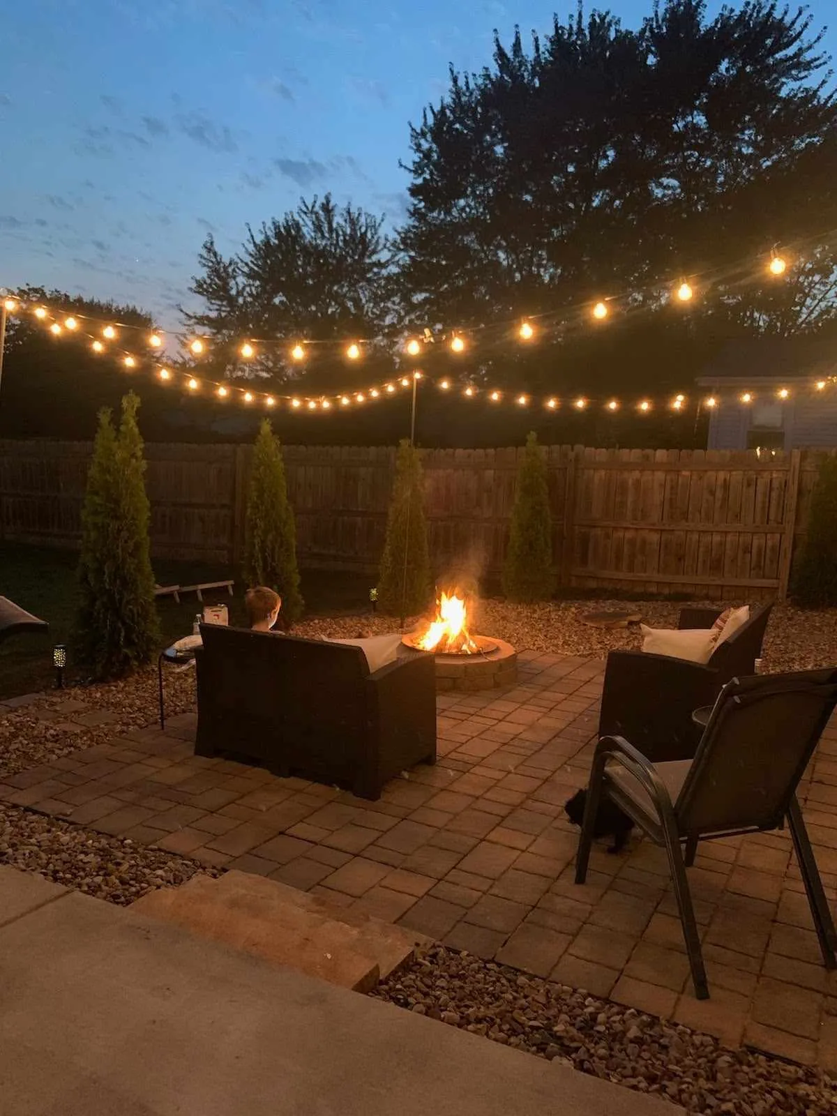 Custom outdoor patio installation with pavers and stone design